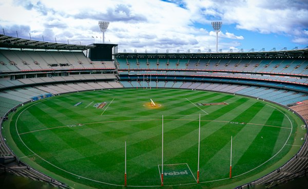 The MCG empty on a cloudy day, the oval and stands waiting for a crowd