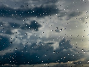 Rain drops building on a window before a storm